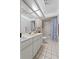 Well-maintained bathroom featuring ample vanity space and tub-shower combination at 2987 Plantation Rd, Winter Haven, FL 33884