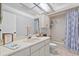 Bright bathroom with a vanity and bath tub with shower combo, perfect for relaxing at 2987 Plantation Rd, Winter Haven, FL 33884