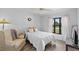 Cozy bedroom with bright window, stylish decor, and wood-look floors at 2987 Plantation Rd, Winter Haven, FL 33884