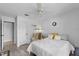 Bright bedroom with neutral walls, modern flooring, chair, and a ceiling fan at 2987 Plantation Rd, Winter Haven, FL 33884
