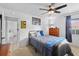Cozy bedroom with ceiling fan, natural light, and hardwood flooring at 2987 Plantation Rd, Winter Haven, FL 33884
