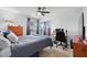 Comfortable bedroom includes a ceiling fan, study space, and natural light at 2987 Plantation Rd, Winter Haven, FL 33884