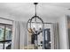 Dining area featuring an elegant pendant light fixture and view to backyard at 2987 Plantation Rd, Winter Haven, FL 33884