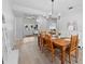 Dining room with wood table, decor, and a view to the front door at 2987 Plantation Rd, Winter Haven, FL 33884