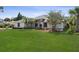 Lush front yard with a well-maintained lawn and inviting exterior at 2987 Plantation Rd, Winter Haven, FL 33884