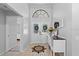 Elegant foyer with high ceilings, decorative doors, and a stylish console table at 2987 Plantation Rd, Winter Haven, FL 33884