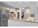 Spacious kitchen boasts stainless steel appliances, white cabinets, and ample counter space at 2987 Plantation Rd, Winter Haven, FL 33884