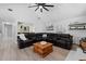 Comfortable living room with large sectional sofa, vaulted ceilings, and neutral colors at 2987 Plantation Rd, Winter Haven, FL 33884