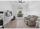 Bright living room featuring modern furnishings, hardwood floors, and large window at 2987 Plantation Rd, Winter Haven, FL 33884