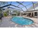 Stunning screened-in pool area with surrounding patio space and outdoor entertaining areas at 2987 Plantation Rd, Winter Haven, FL 33884