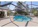 The screened in pool with a brick hot tub is perfect for escaping the Florida heat at 2987 Plantation Rd, Winter Haven, FL 33884