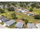 An aerial view showcases the community's homes along the golf course fairways and manicured landscape at 3245 Prairie Dunes E Cir, Lakeland, FL 33810