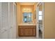 Bathroom features a vanity with ample counter space and a mirror with a vanity light at 3245 Prairie Dunes E Cir, Lakeland, FL 33810