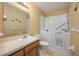 Accessible bathroom featuring a walk-in shower and safety bars for added convenience at 3245 Prairie Dunes E Cir, Lakeland, FL 33810