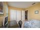 Cozy bedroom featuring a computer desk, a spacious closet and ample natural light at 3245 Prairie Dunes E Cir, Lakeland, FL 33810
