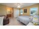 Serene bedroom with a double bed, en-suite bathroom, and closet at 3245 Prairie Dunes E Cir, Lakeland, FL 33810