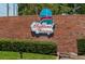 Highland Fairways community sign featuring a brick wall and manicured landscaping at 3245 Prairie Dunes E Cir, Lakeland, FL 33810
