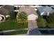 Aerial view of the house showing the driveway, front yard, and landscaping at 3828 Eloise Estates Ct, Winter Haven, FL 33881