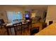 Open-concept dining area with wood flooring and views to the living room at 3828 Eloise Estates Ct, Winter Haven, FL 33881