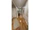 Inviting hallway with wooden floors, light neutral walls and white trim at 3828 Eloise Estates Ct, Winter Haven, FL 33881