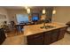 Kitchen with granite countertops and dark wood cabinetry. Open floorplan at 3828 Eloise Estates Ct, Winter Haven, FL 33881