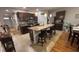 Stylish kitchen with granite countertops, dark cabinets, stainless steel appliances, and a kitchen island at 3828 Eloise Estates Ct, Winter Haven, FL 33881