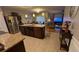 Open kitchen featuring stainless steel appliances and a large island with a granite countertop at 3828 Eloise Estates Ct, Winter Haven, FL 33881