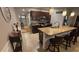Kitchen featuring granite countertops and dark cabinets, open to the dining area with stylish pendant lighting at 3828 Eloise Estates Ct, Winter Haven, FL 33881
