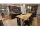 Kitchen with dark cabinets, granite countertops, stainless steel appliances, and large island at 3828 Eloise Estates Ct, Winter Haven, FL 33881
