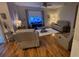 Cozy living room featuring wood floors, a ceiling fan, and comfortable furniture at 3828 Eloise Estates Ct, Winter Haven, FL 33881