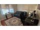 Bright home office with a desk, chair, sofa, area rug, and window with natural light at 3828 Eloise Estates Ct, Winter Haven, FL 33881