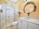 Bathroom featuring a glass-enclosed shower and white vanity at 4004 Sable Loop Dr, Lake Wales, FL 33859