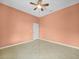 Spacious bedroom featuring tile floors and a ceiling fan at 4004 Sable Loop Dr, Lake Wales, FL 33859