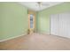 Green bedroom featuring tile floors, double closet and window at 4004 Sable Loop Dr, Lake Wales, FL 33859