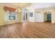 Inviting dining room with wood floors, chandelier lighting, and decorative arched doorway at 4004 Sable Loop Dr, Lake Wales, FL 33859