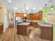 Well-equipped kitchen featuring granite countertops, wood cabinetry, and stainless steel appliances at 4004 Sable Loop Dr, Lake Wales, FL 33859