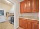 A laundry room with granite countertops and ample cabinet storage at 4004 Sable Loop Dr, Lake Wales, FL 33859