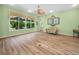 Spacious living room with large windows providing natural light and scenic backyard views at 4004 Sable Loop Dr, Lake Wales, FL 33859