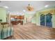 Open-concept living space featuring tile floors, wood cabinets, and an island at 4004 Sable Loop Dr, Lake Wales, FL 33859