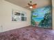 This screened patio features brick flooring, a ceiling fan, and backyard access at 4004 Sable Loop Dr, Lake Wales, FL 33859