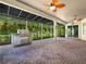 A screened patio offers a covered space and includes a stainless steel grill at 4004 Sable Loop Dr, Lake Wales, FL 33859