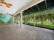 This screened patio offers a covered space and views of the surrounding landscape at 4004 Sable Loop Dr, Lake Wales, FL 33859