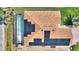 Aerial view of a home featuring a screened pool and solar panels on the roof at 4175 Muirfield Loop, Lake Wales, FL 33859