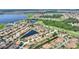 Beautiful aerial view of community featuring ponds, golf course, and well-maintained homes at 4175 Muirfield Loop, Lake Wales, FL 33859