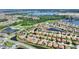 Beautiful aerial view of community featuring ponds, golf course, and well-maintained homes at 4175 Muirfield Loop, Lake Wales, FL 33859