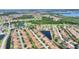 Beautiful aerial view of community featuring ponds, golf course, and well-maintained homes at 4175 Muirfield Loop, Lake Wales, FL 33859