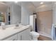 Clean bathroom featuring a vanity, toilet, and a tiled walk-in shower at 4175 Muirfield Loop, Lake Wales, FL 33859