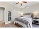 Cozy bedroom with a ceiling fan, two closets, and laminate wood flooring at 4175 Muirfield Loop, Lake Wales, FL 33859