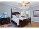 Bright bedroom features wood-look flooring and a view into the laundry room at 4175 Muirfield Loop, Lake Wales, FL 33859