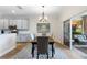 Modern dining area with sliding glass doors to the patio, connecting indoor/outdoor living at 4175 Muirfield Loop, Lake Wales, FL 33859